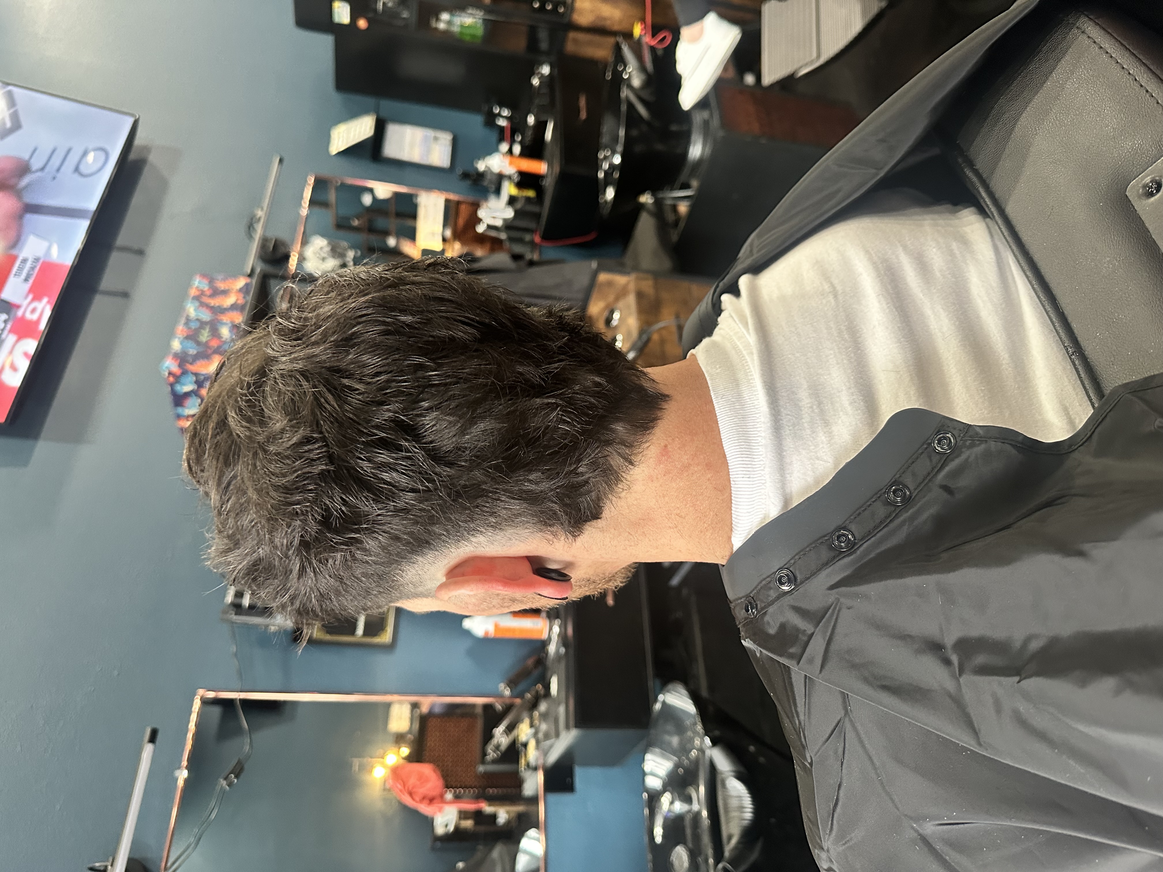 Client after transformation, back view of fresh fade and beard lineup